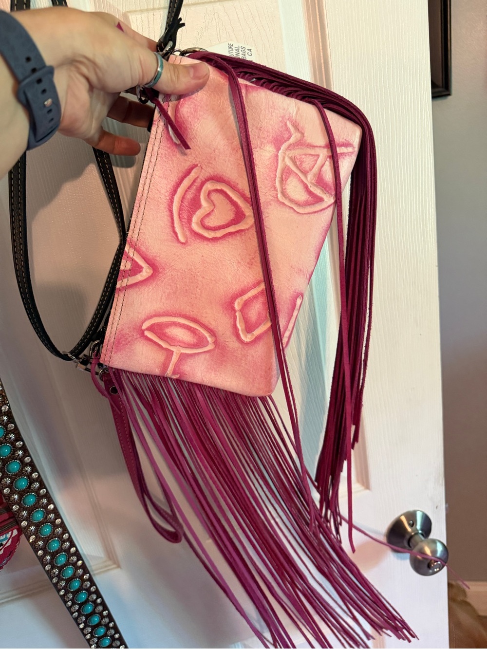 Pink Fringe Crossbody Bag with Embossed Motifs